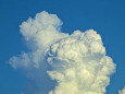 ライオン顔の積乱雲上雲飛行機